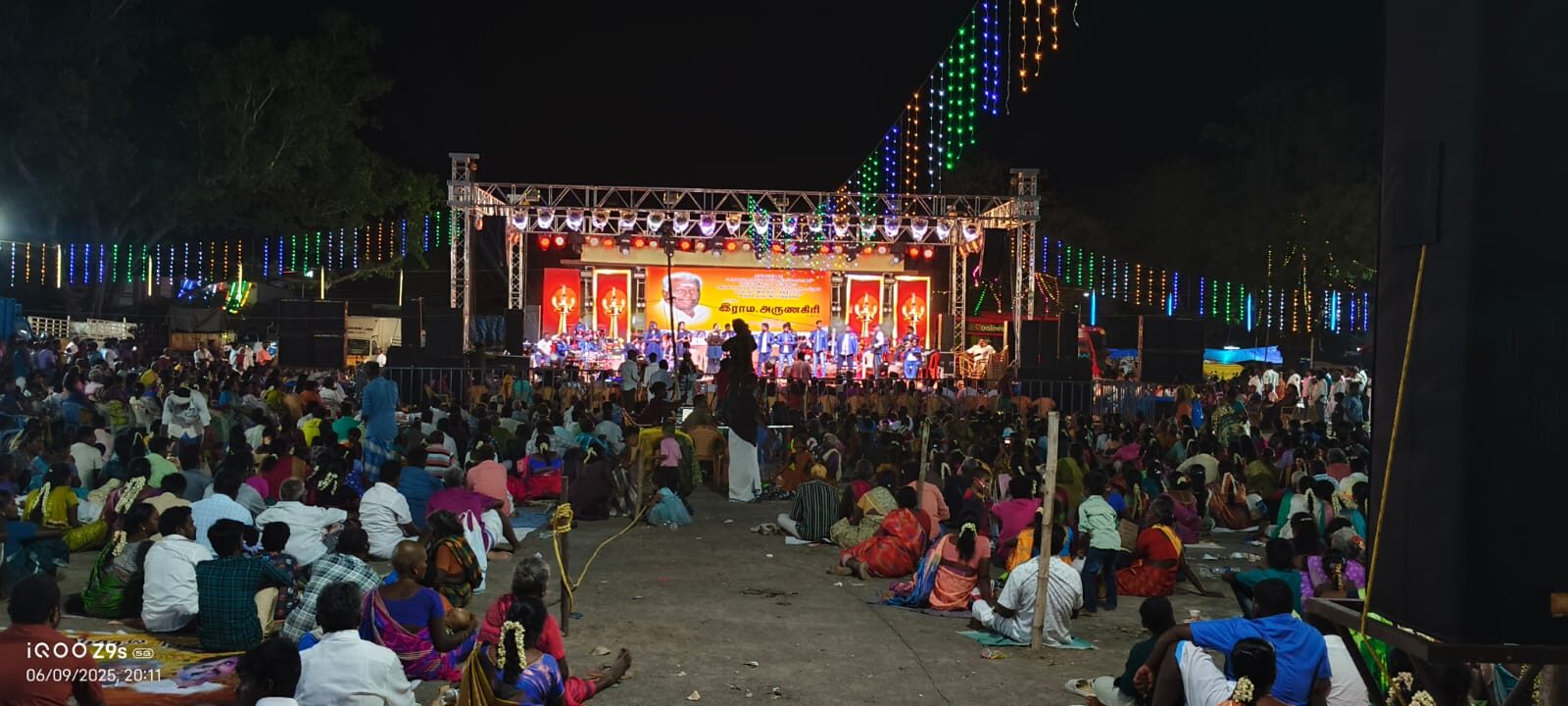 Outdoor festival stage with LED wall and large crowd