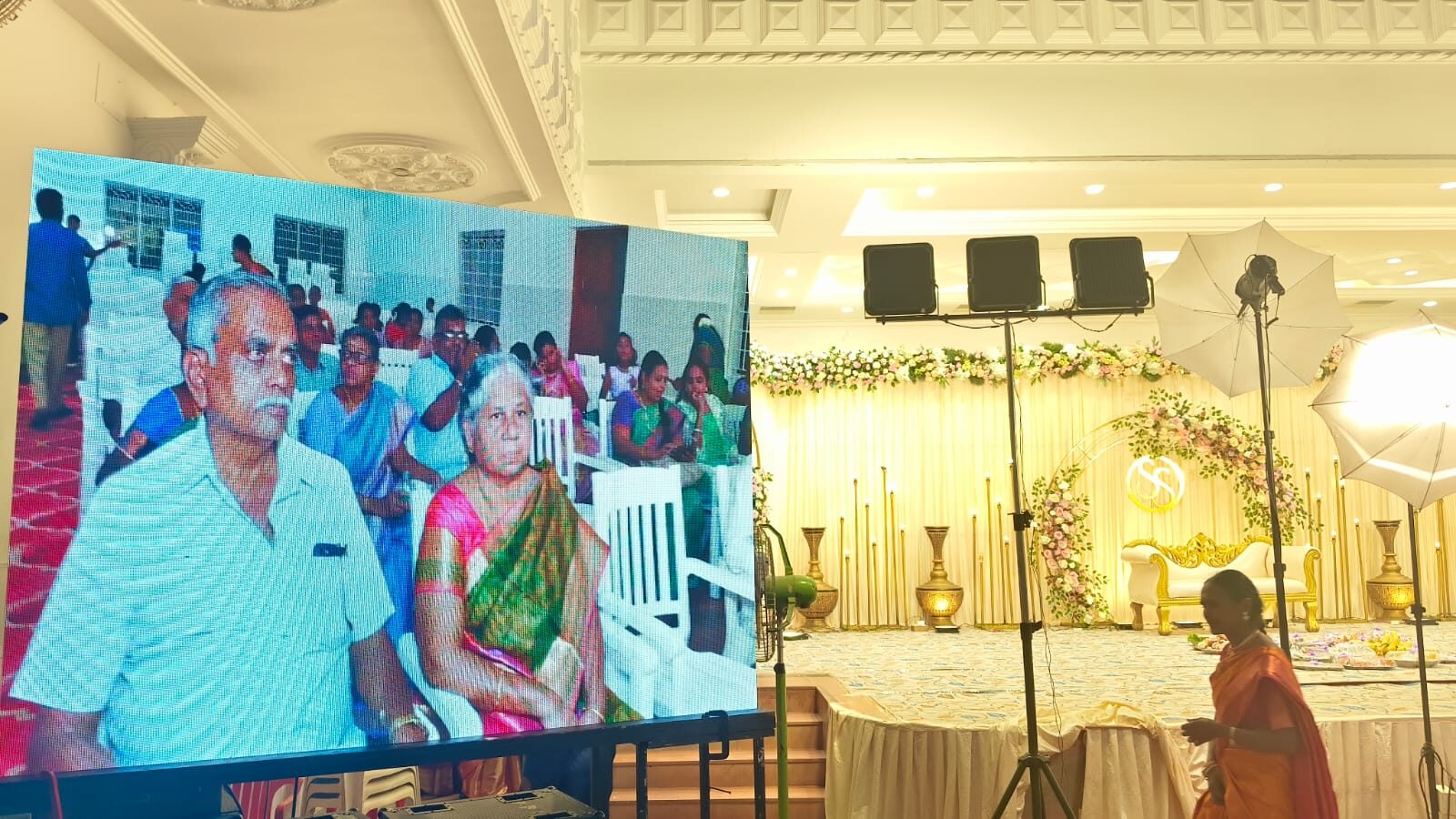 LED live feed at a function with seated guests